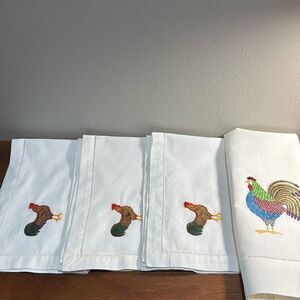 A bundle containing four items: three napkins and one kitchen towel.